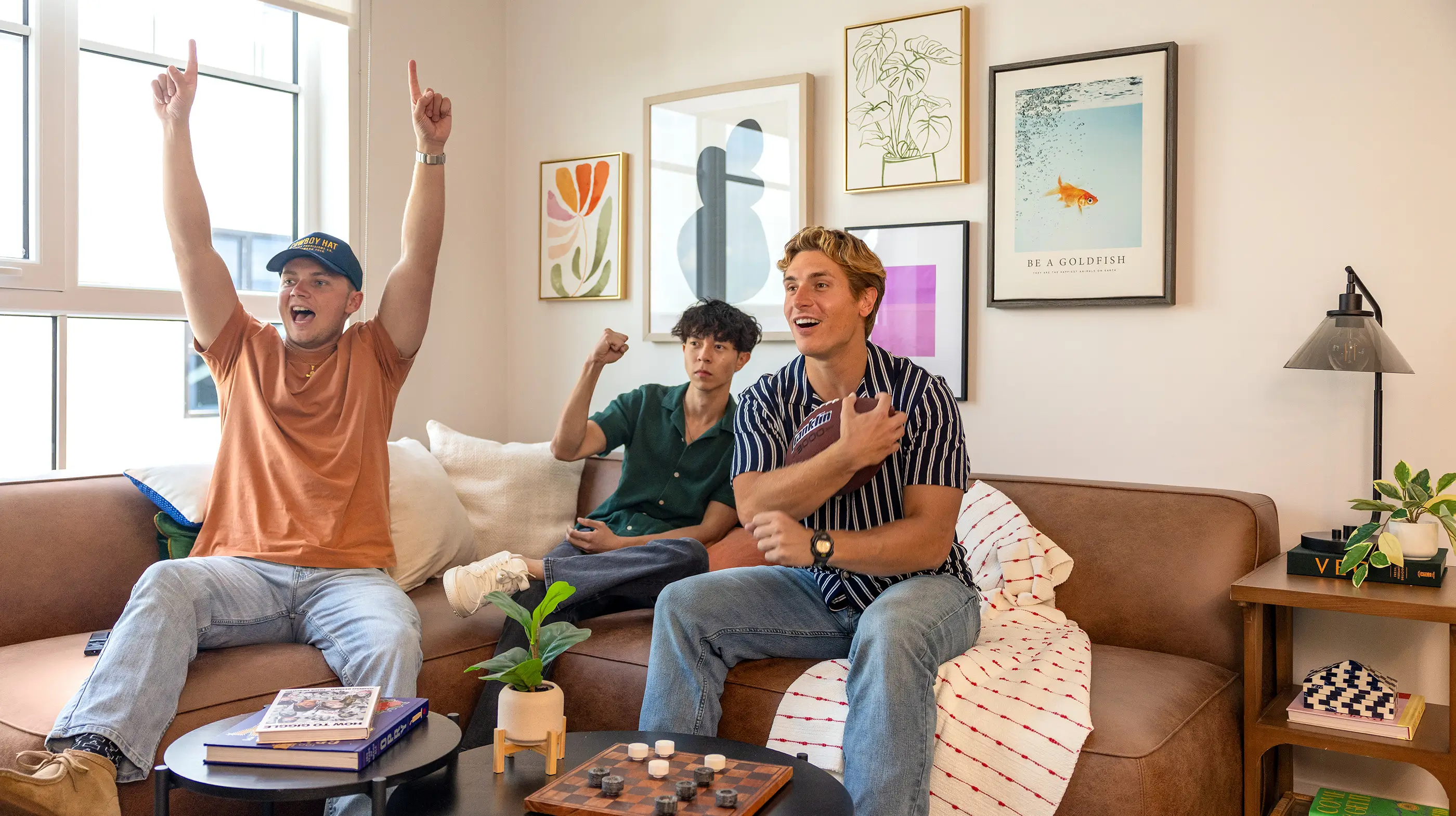 a group of residents hanging out in an apartment living room