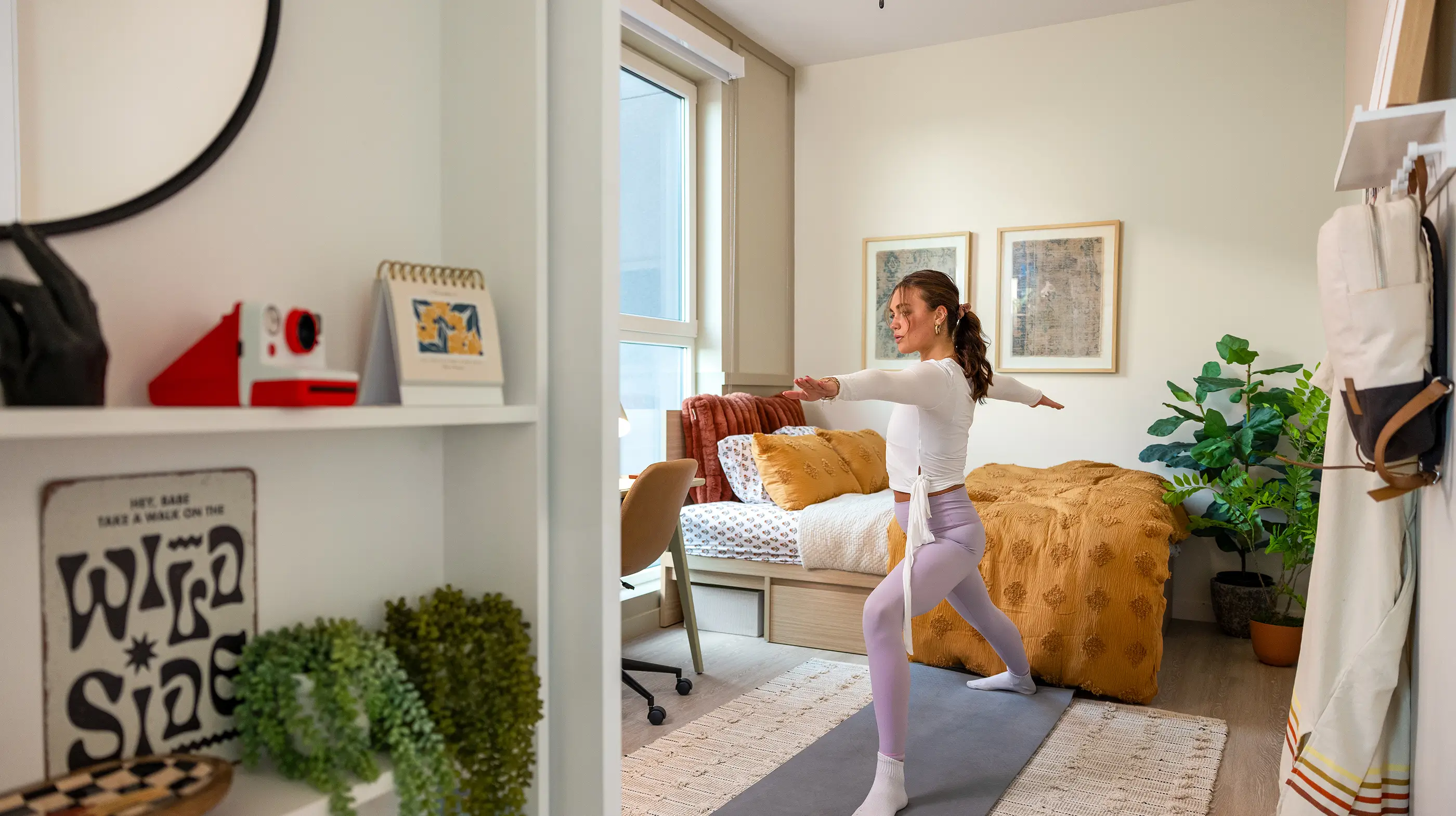 a woman doing yoga inside an apartment