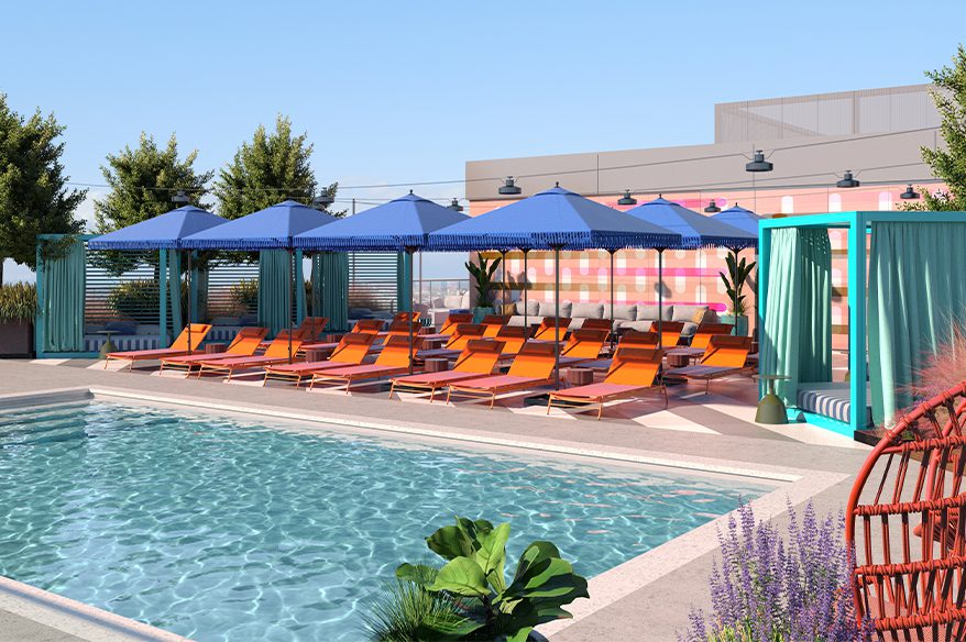 Resort style pool surrounded by lounge chairs