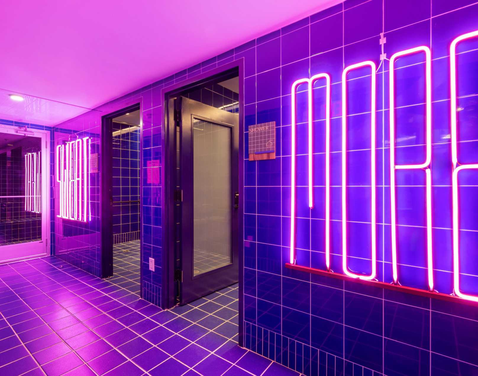 A room with neon purple lights