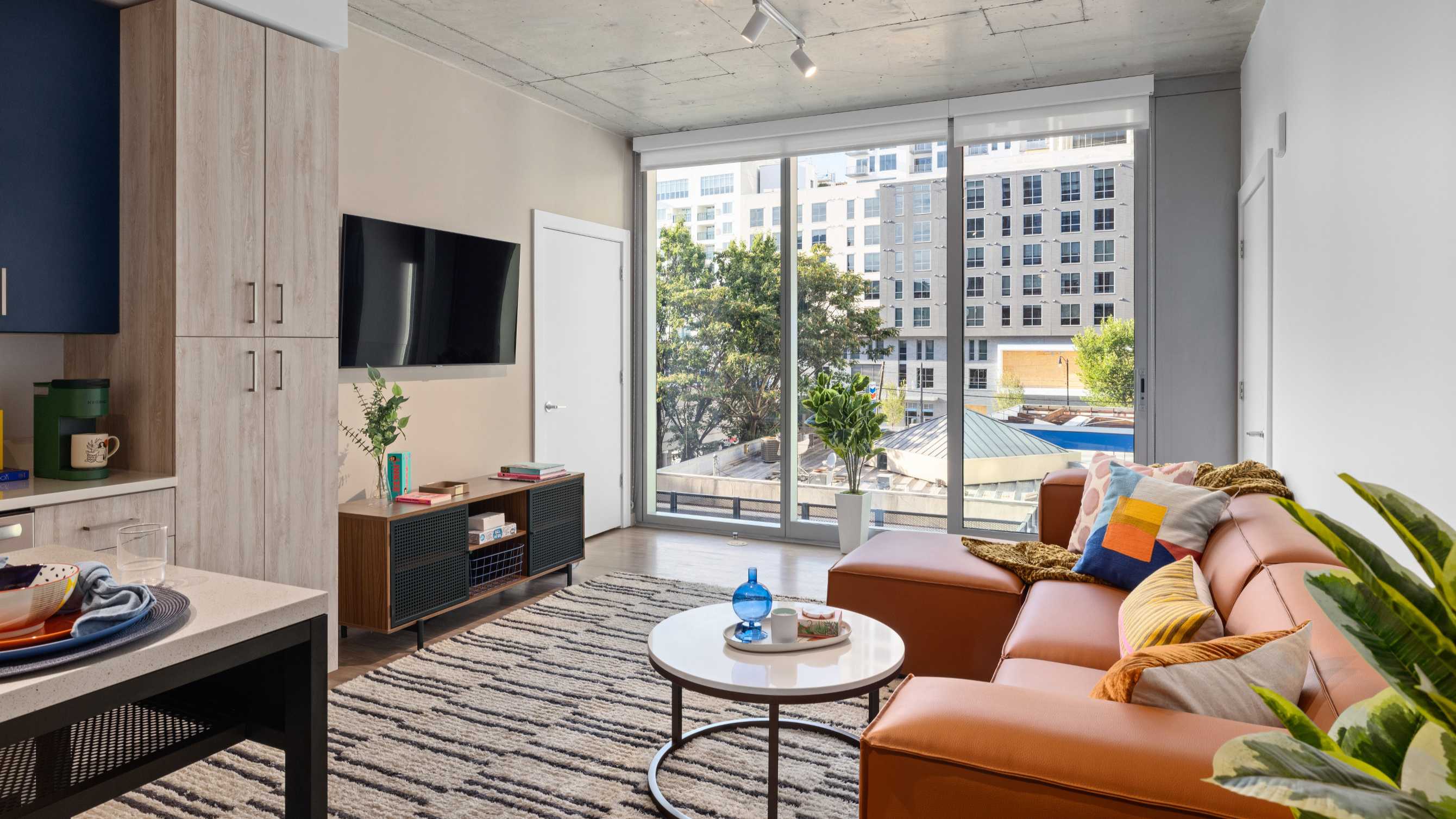 A living room with a couch and a TV