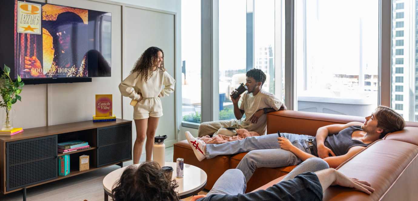 people laughing and watching tv