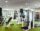 Fitness center with green floors and exercise equipment