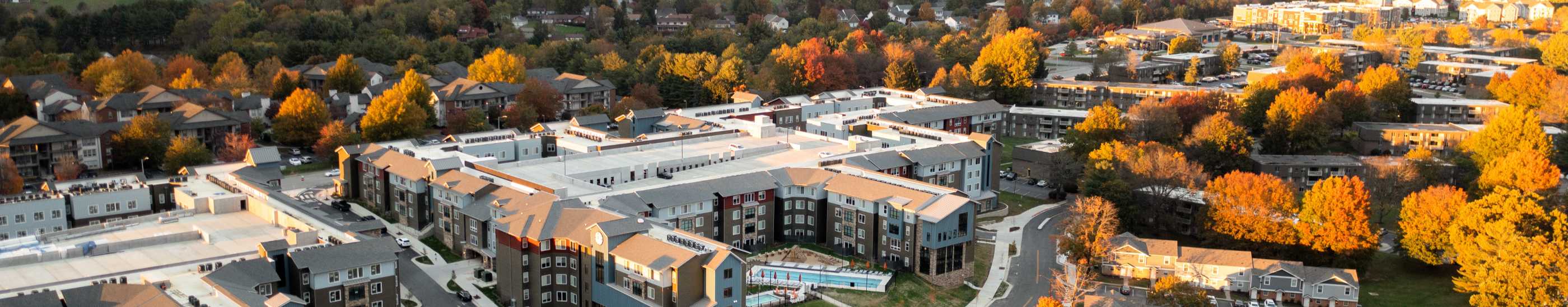 Apartment community near colorful fall trees