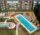 Aerial view of swimming pool and apartment building