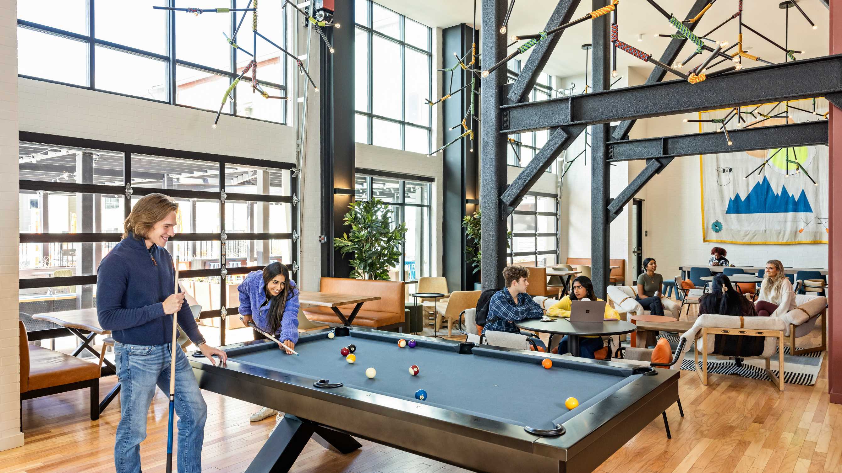 A group of friends playing pool