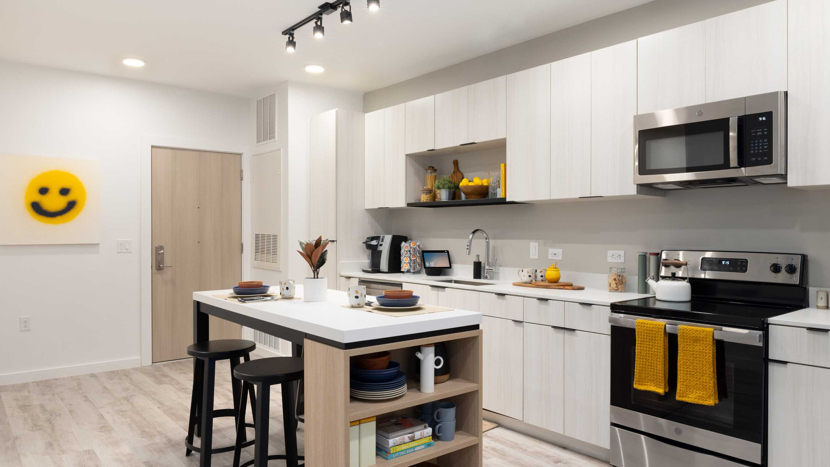 Kitchen with white cabinetry and stainless steel appliances