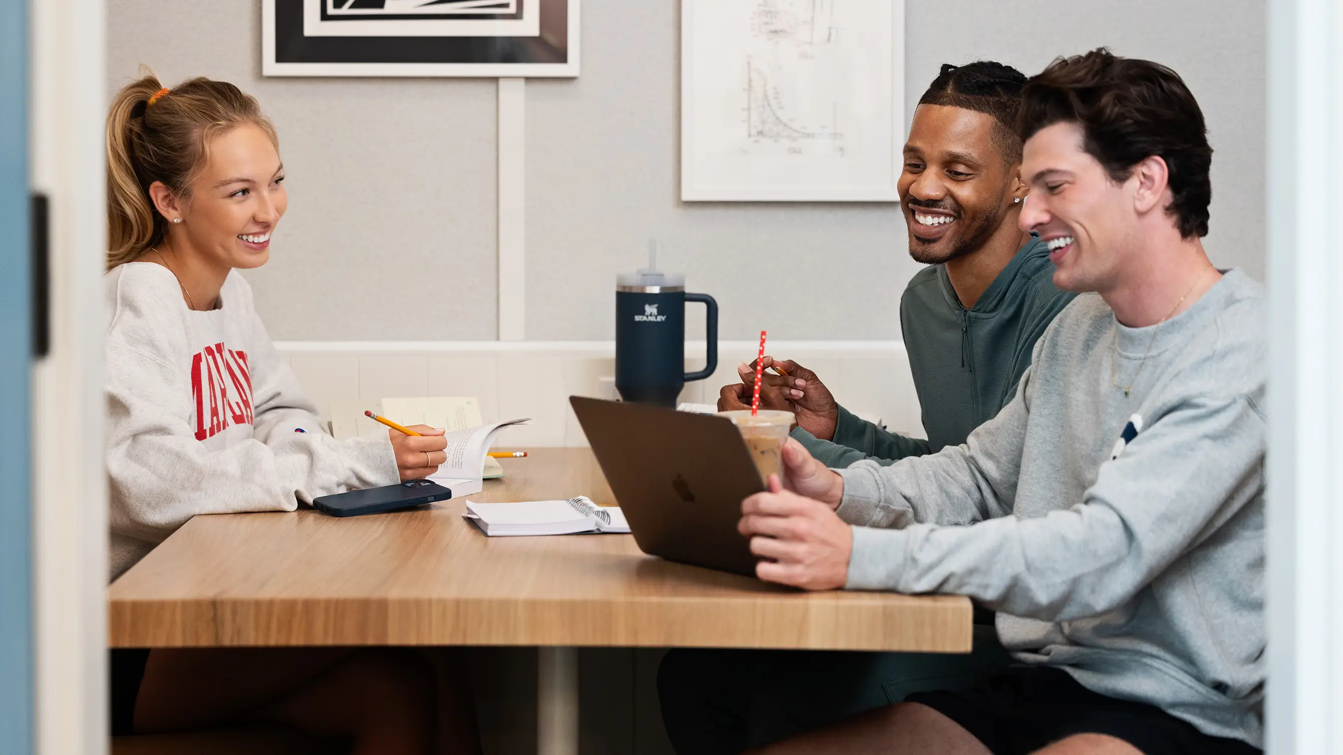 a group of young adults studying together