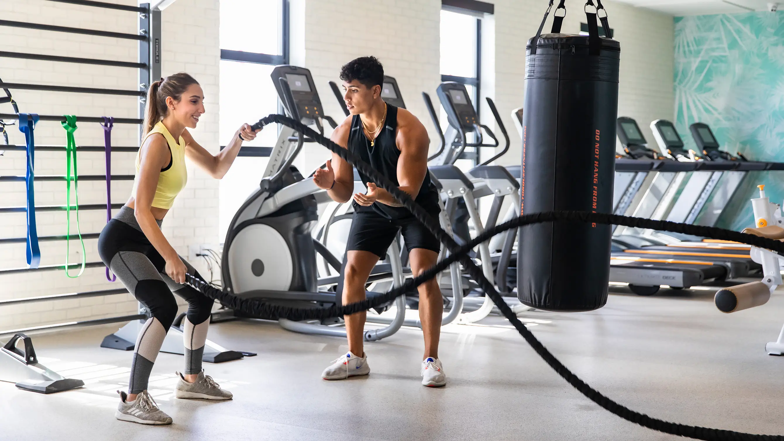 two people working out at the fitness center