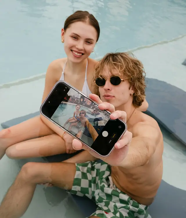 two young adults take a selfie