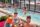 group of people hanging out by the pool