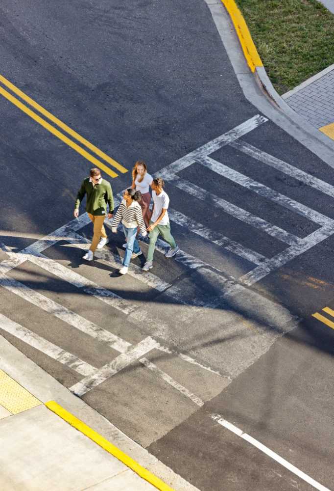 group of friends walking across the street