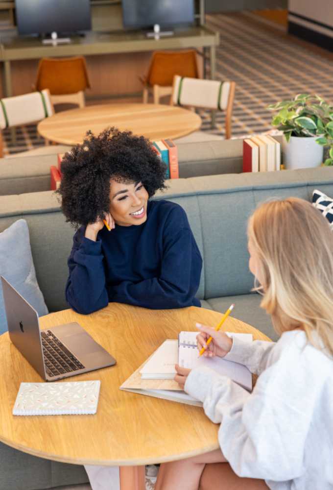 two girls studying