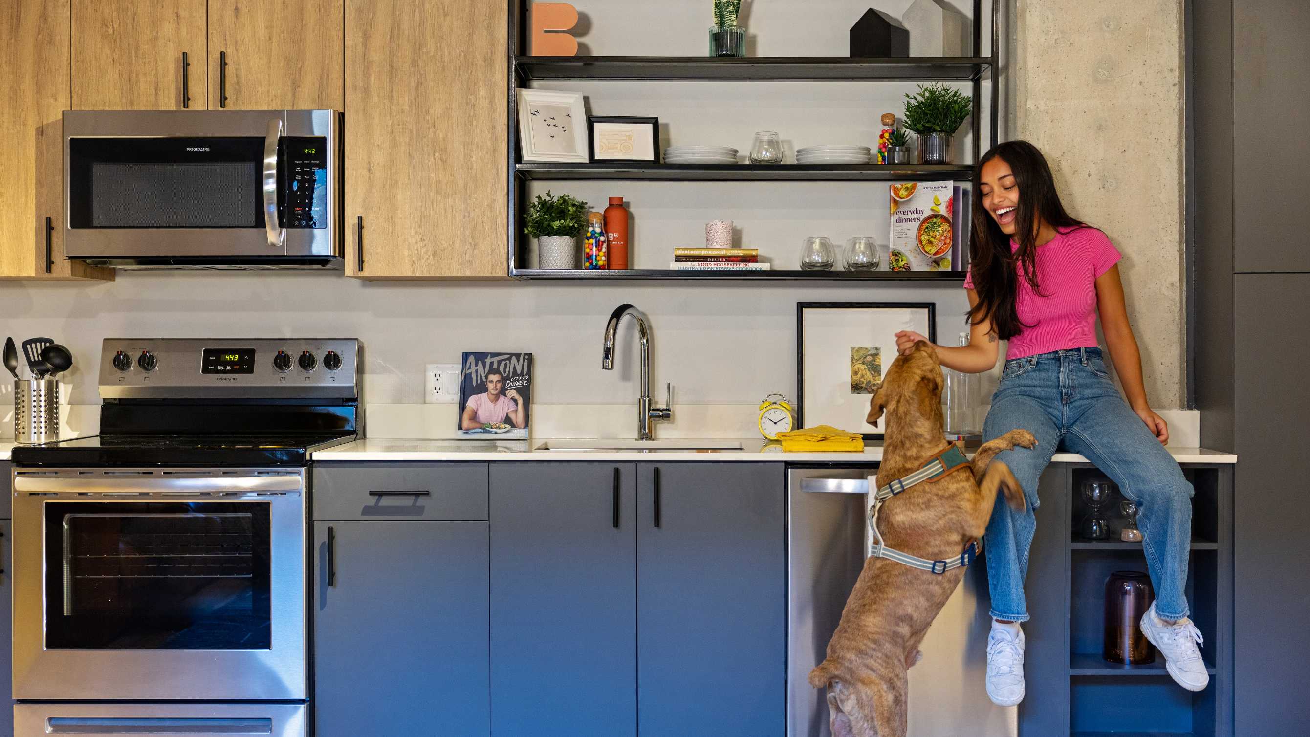 woman playing with dog