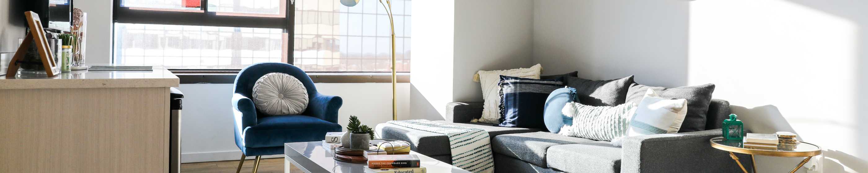 Living room with a coffee table and floor lamp