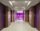 Hallway with purple lights at the end