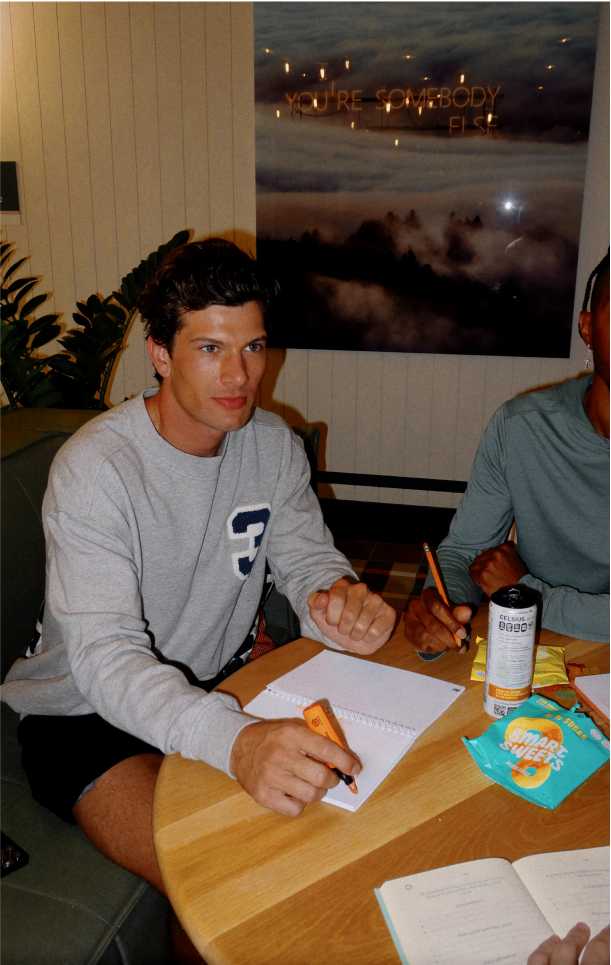 Man studying at a table with snacks