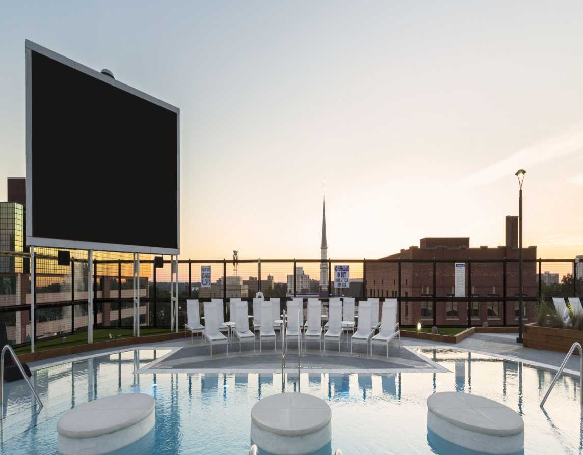 Outdoor TV next to a swimming pool