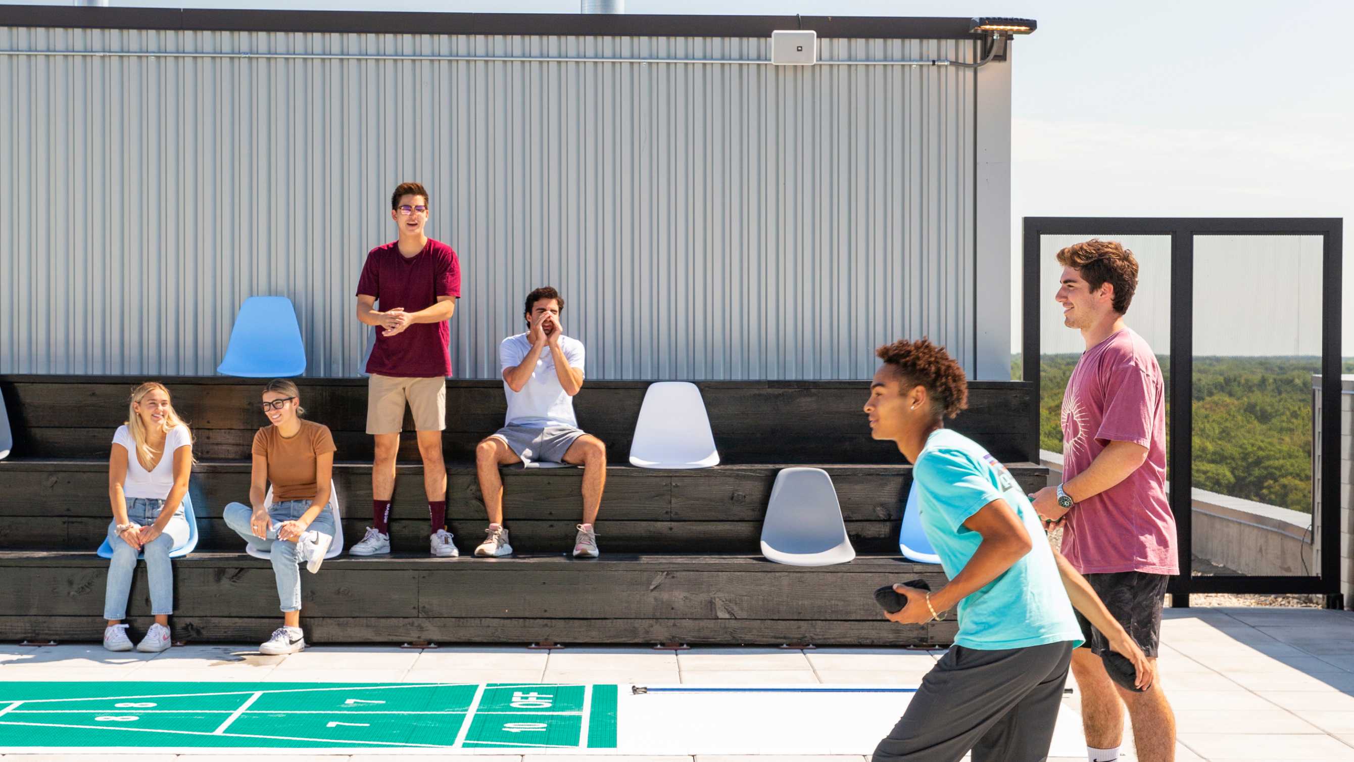 friend playing shuffleboard