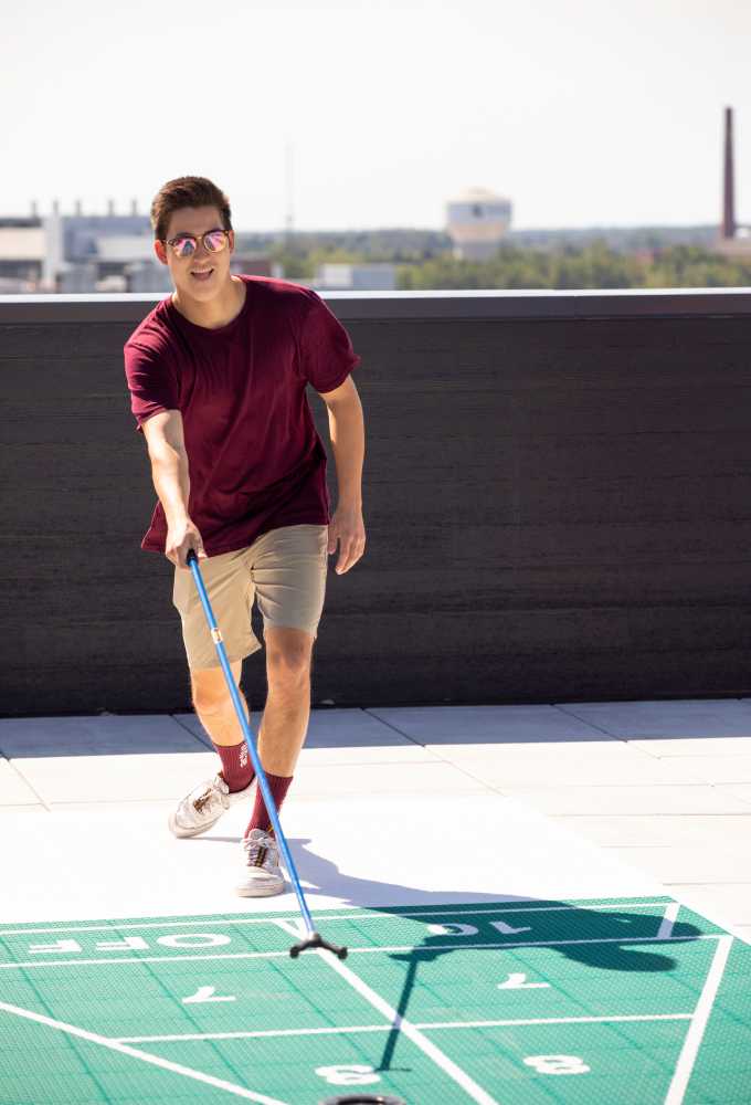 person playing shuffle board