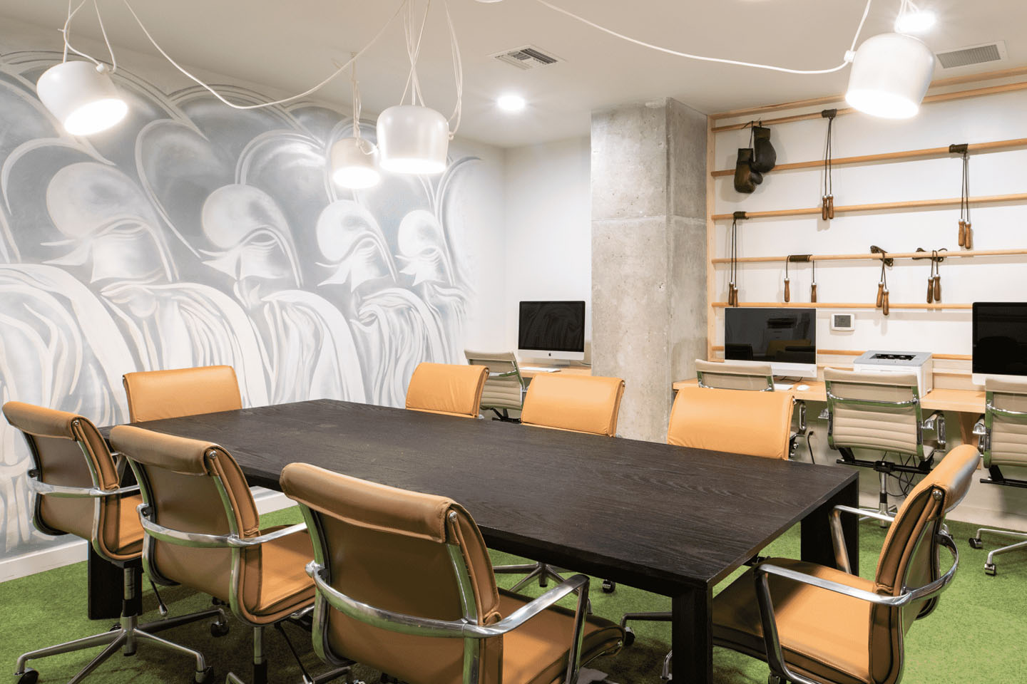 Large conference table and Mac computer stations