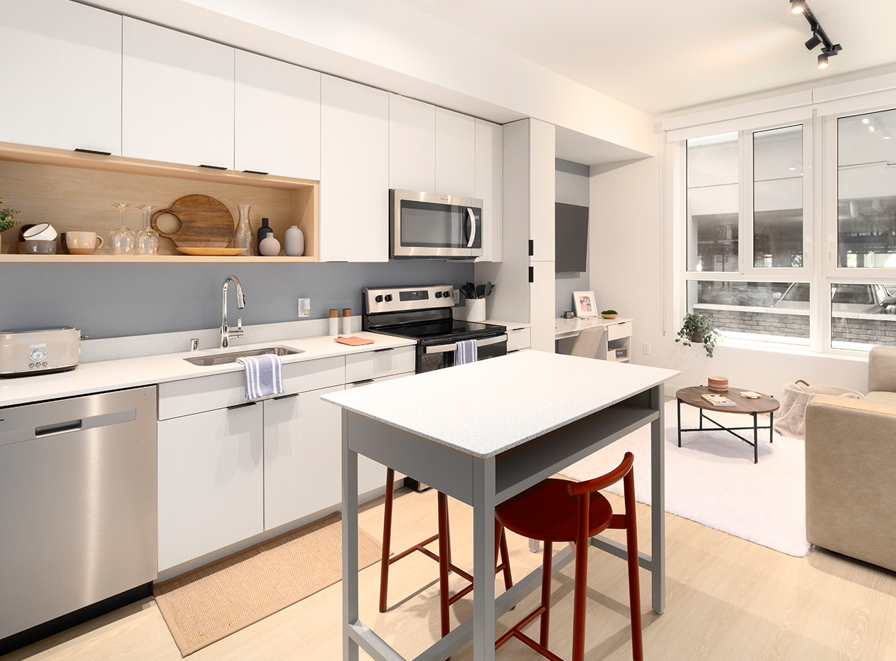 A kitchen with white cabinets