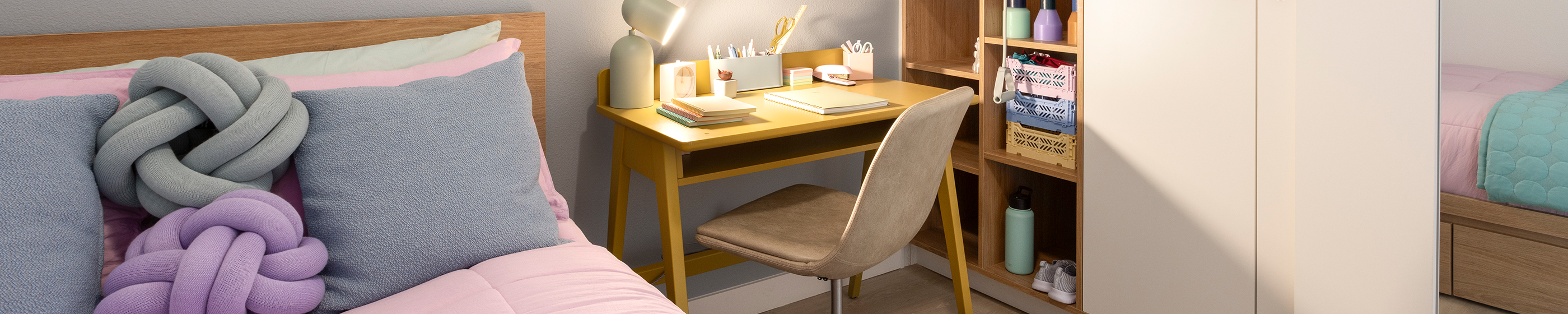 A bedroom with a study desk