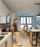 Man standing in a kitchen with white cabinets