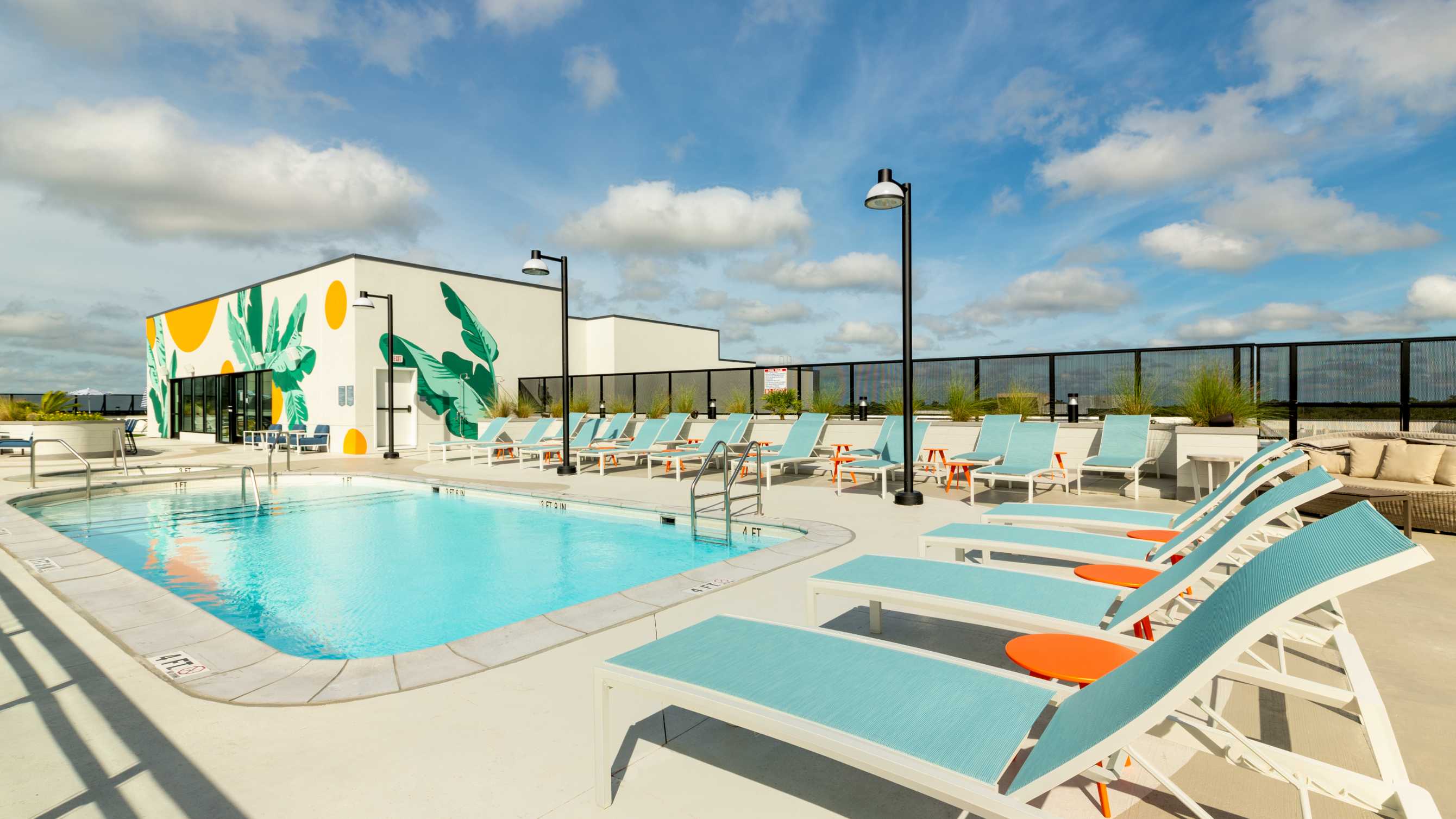 A swimming pool under a bright blue sky