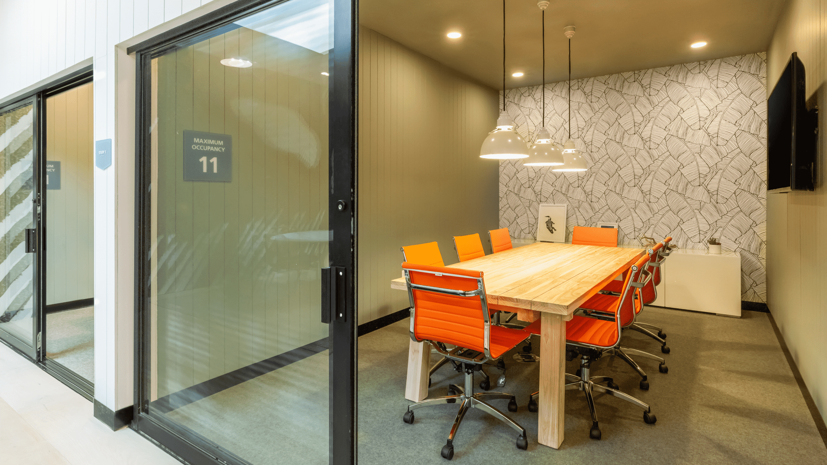 Study room with a table and orange chairs