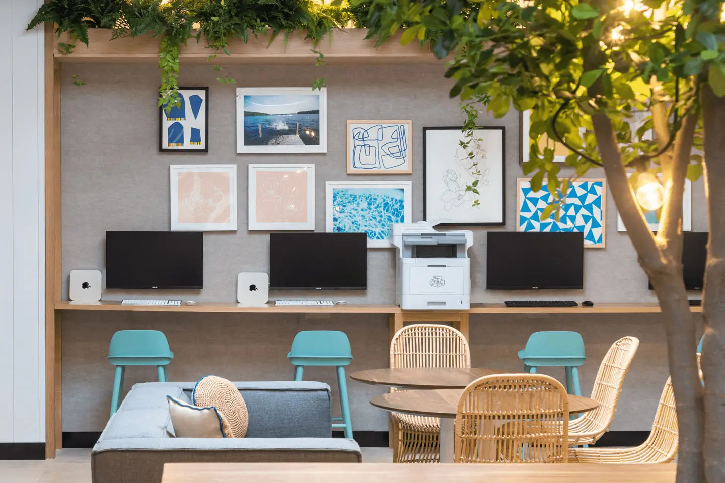 Well-decorated study center with computers and a printer.