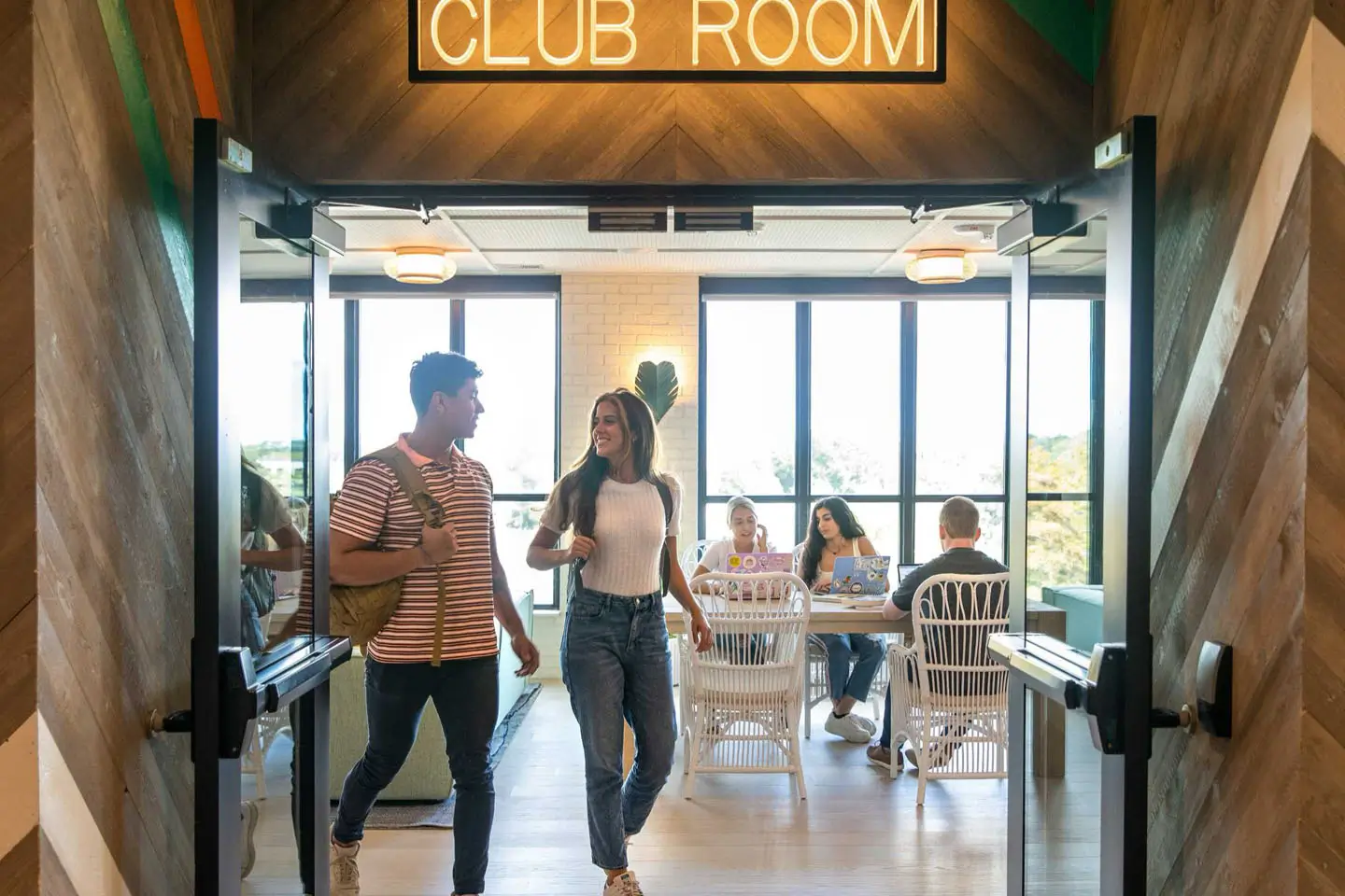 student residents walking into the clubroom