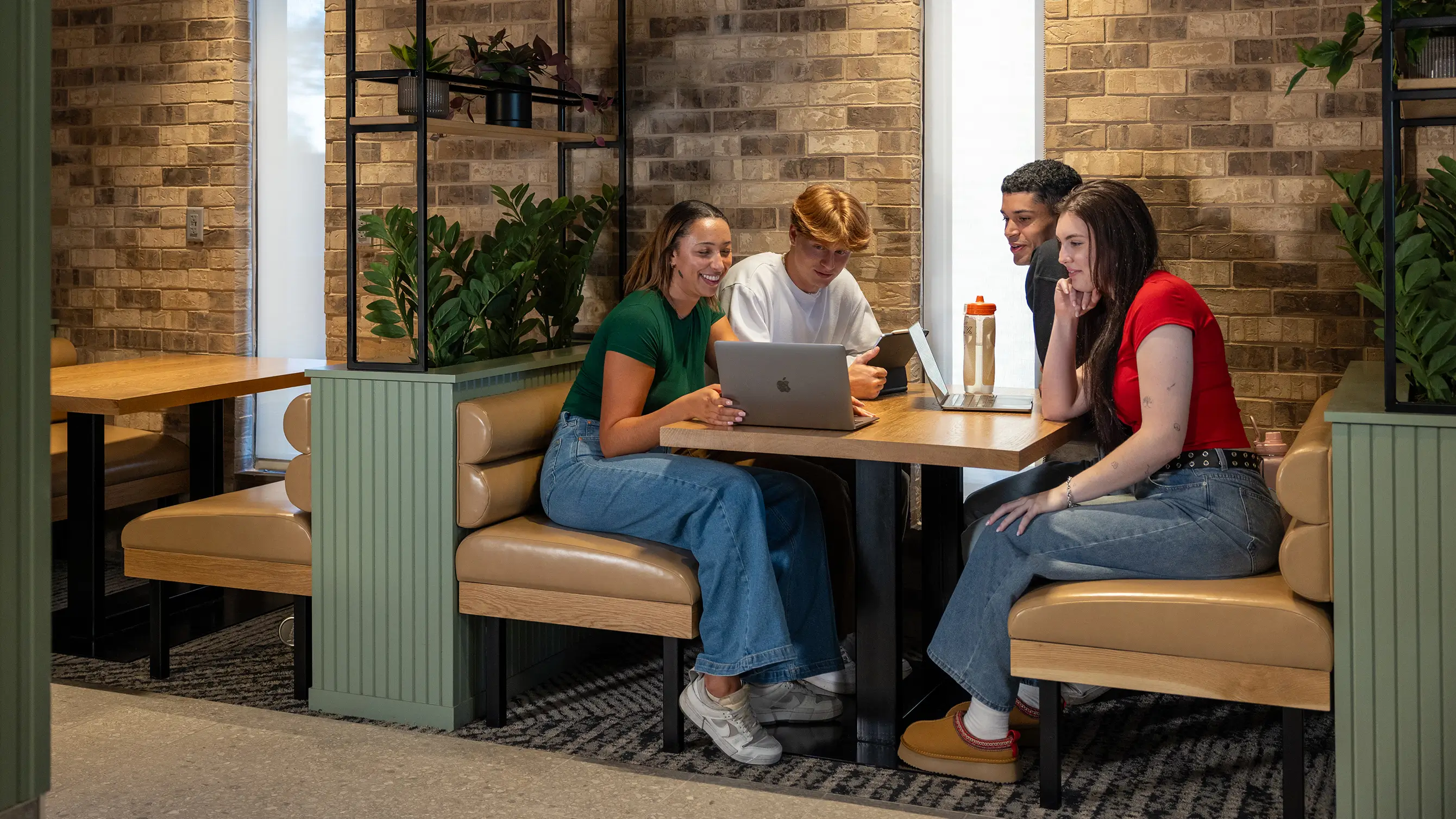 Friends in a study booth