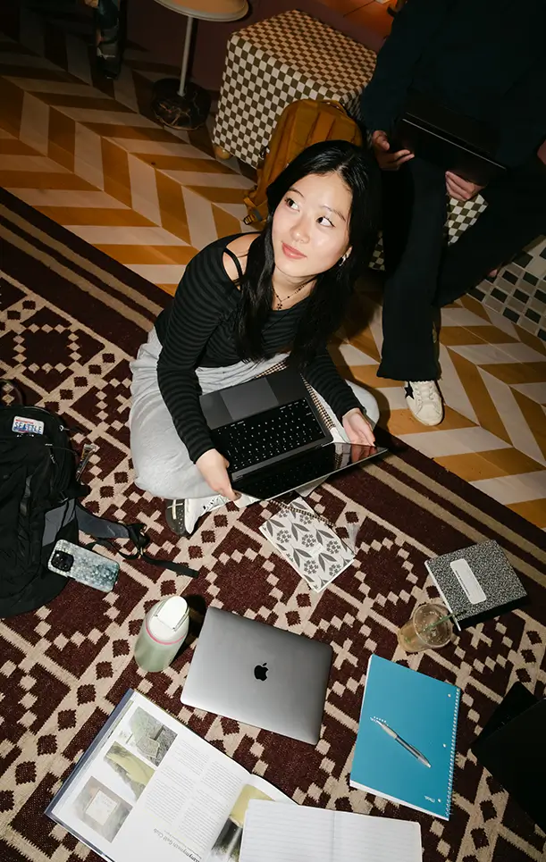 Student studying on the floor