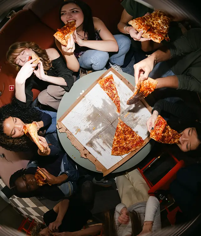 Students eating pizza