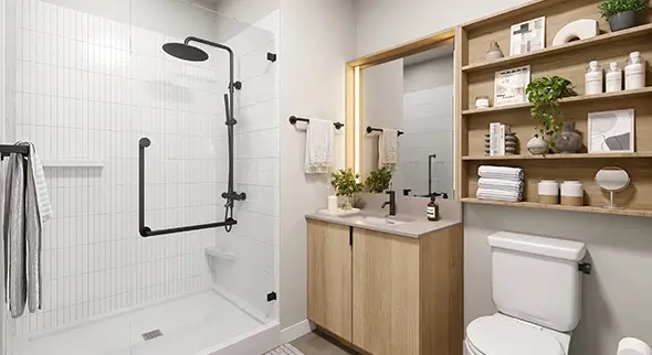 Toilet, shower, and sink with cabinets.