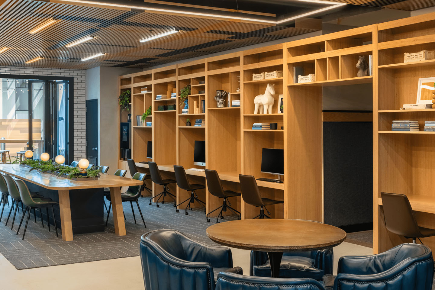 Student center with individual computer stations and group tables.