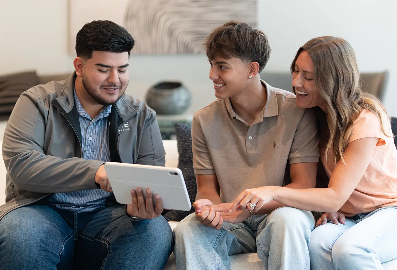 a family crowds a tablet