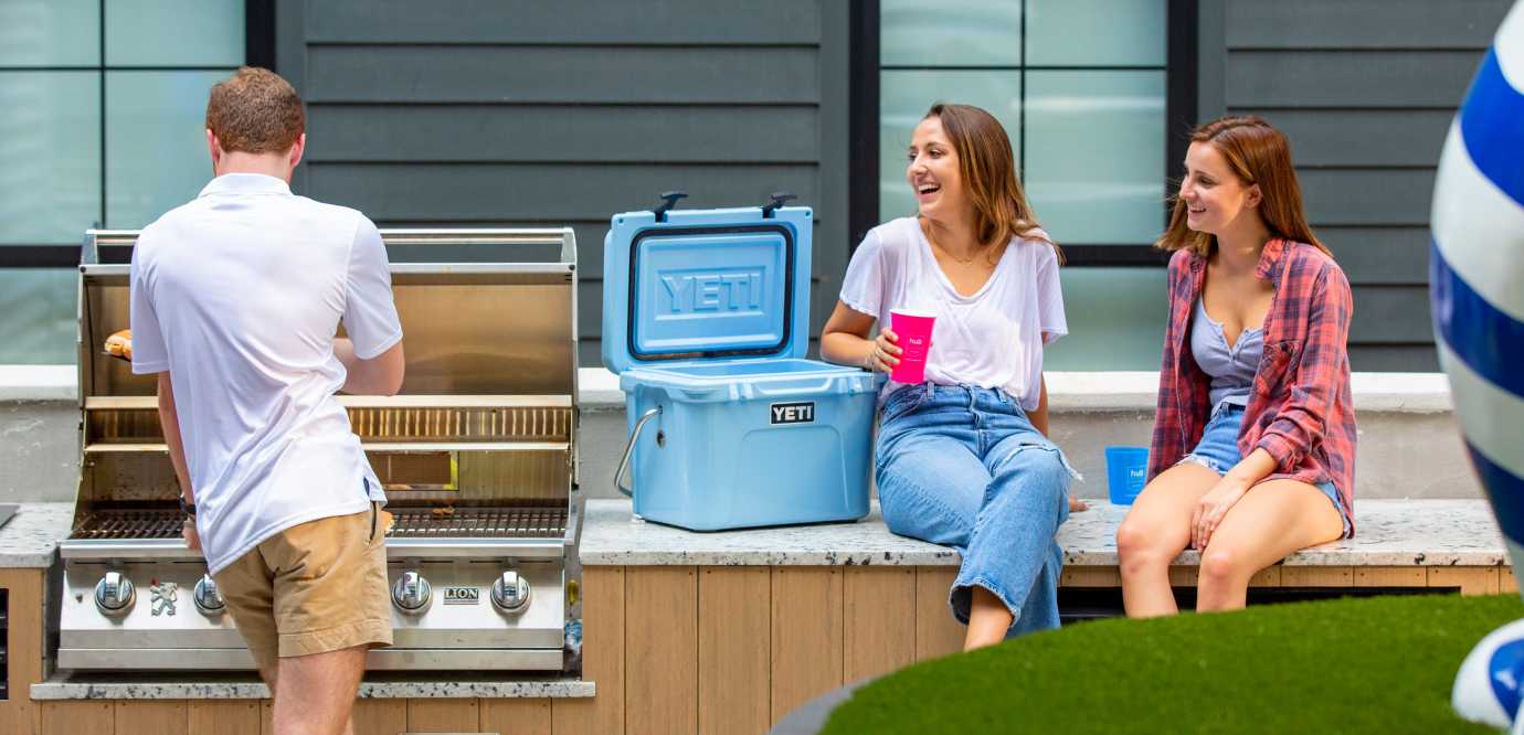 Friends grilling outside