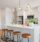 A kitchen with white cabinets