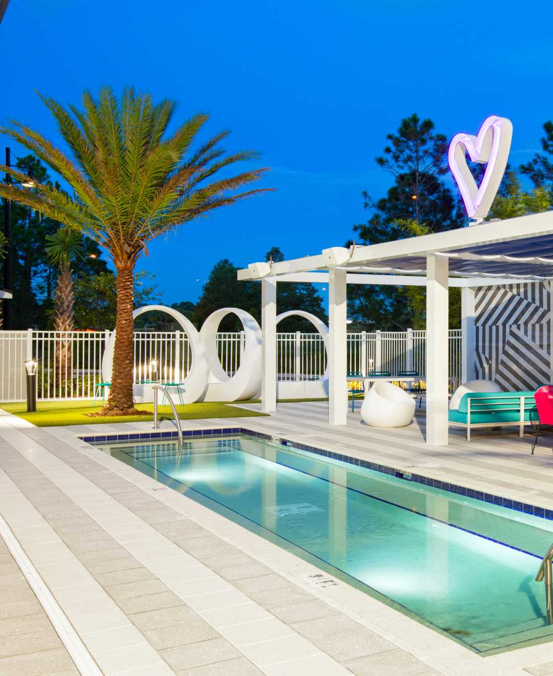 Swimming pool next to a palm tree