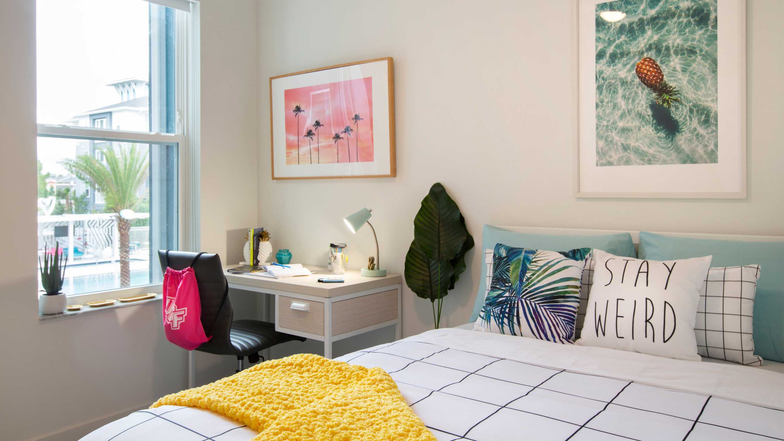 Bedroom with a white bed and a desk