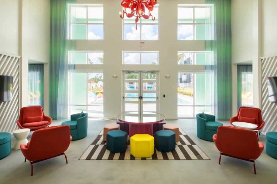 A common area with an orange chandelier