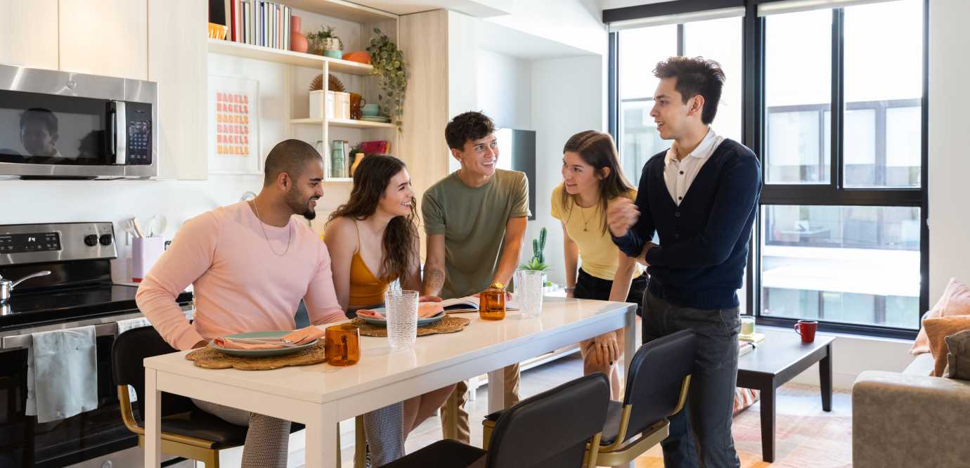 kitchen with people gathered around table