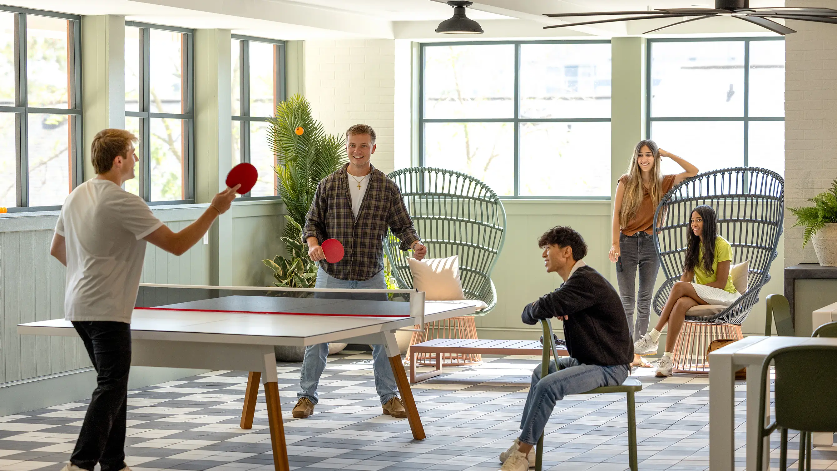 Friends playing table tennis