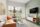 A living room with a table and tv