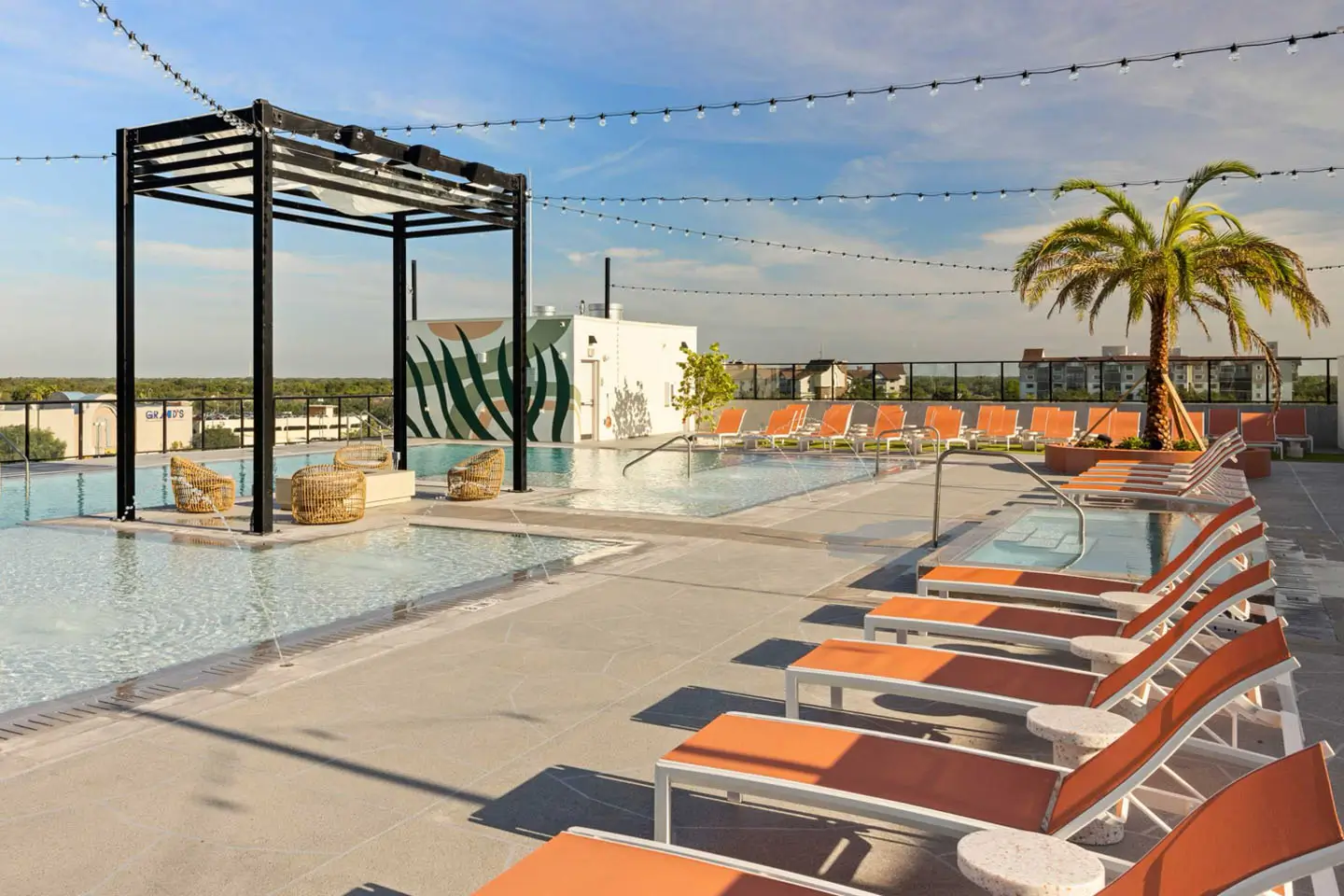 swimming pool with poolside lounge seating