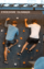 people climbing a rock wall