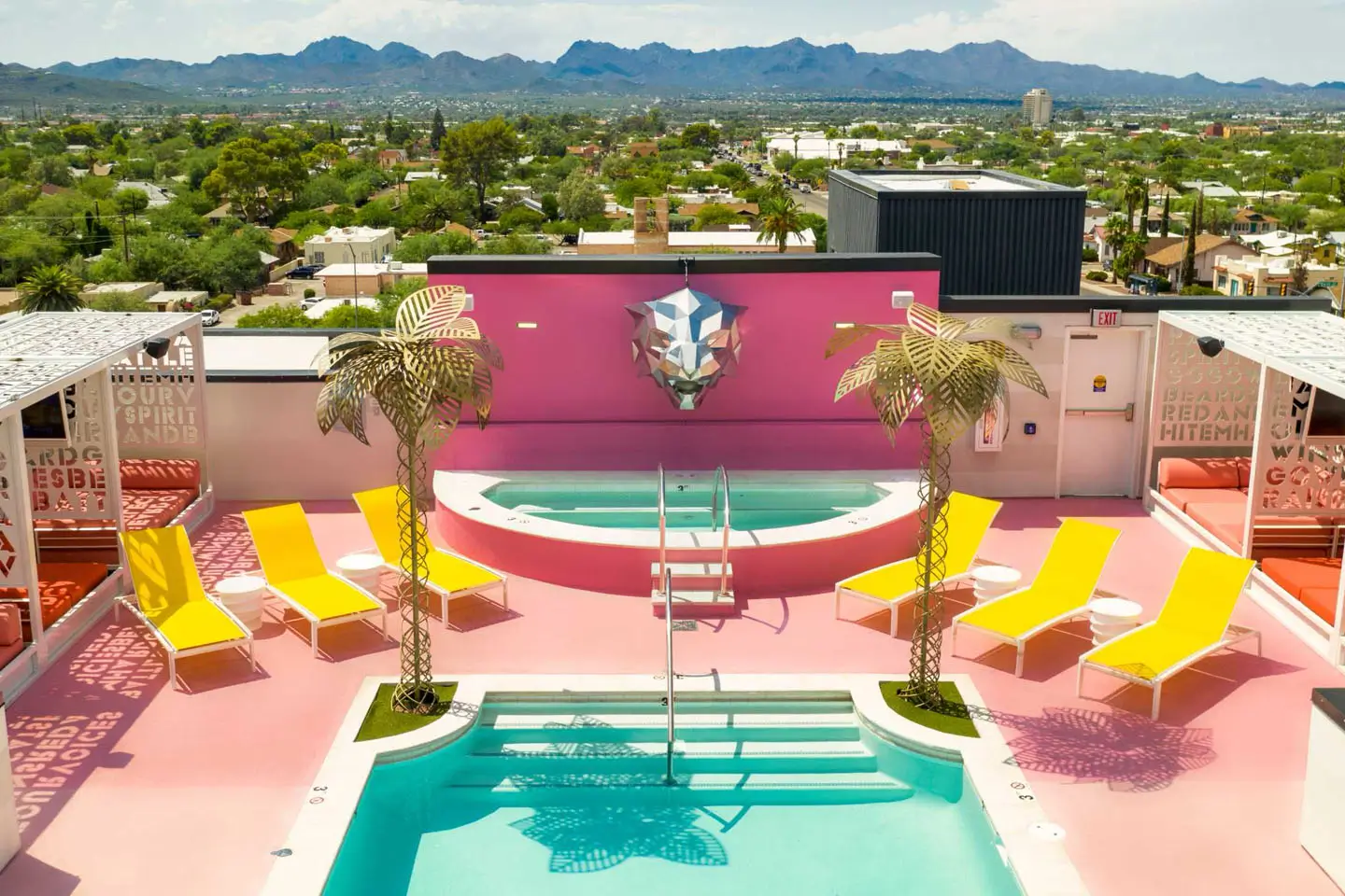 outdoor swimming pool and pink courtyard