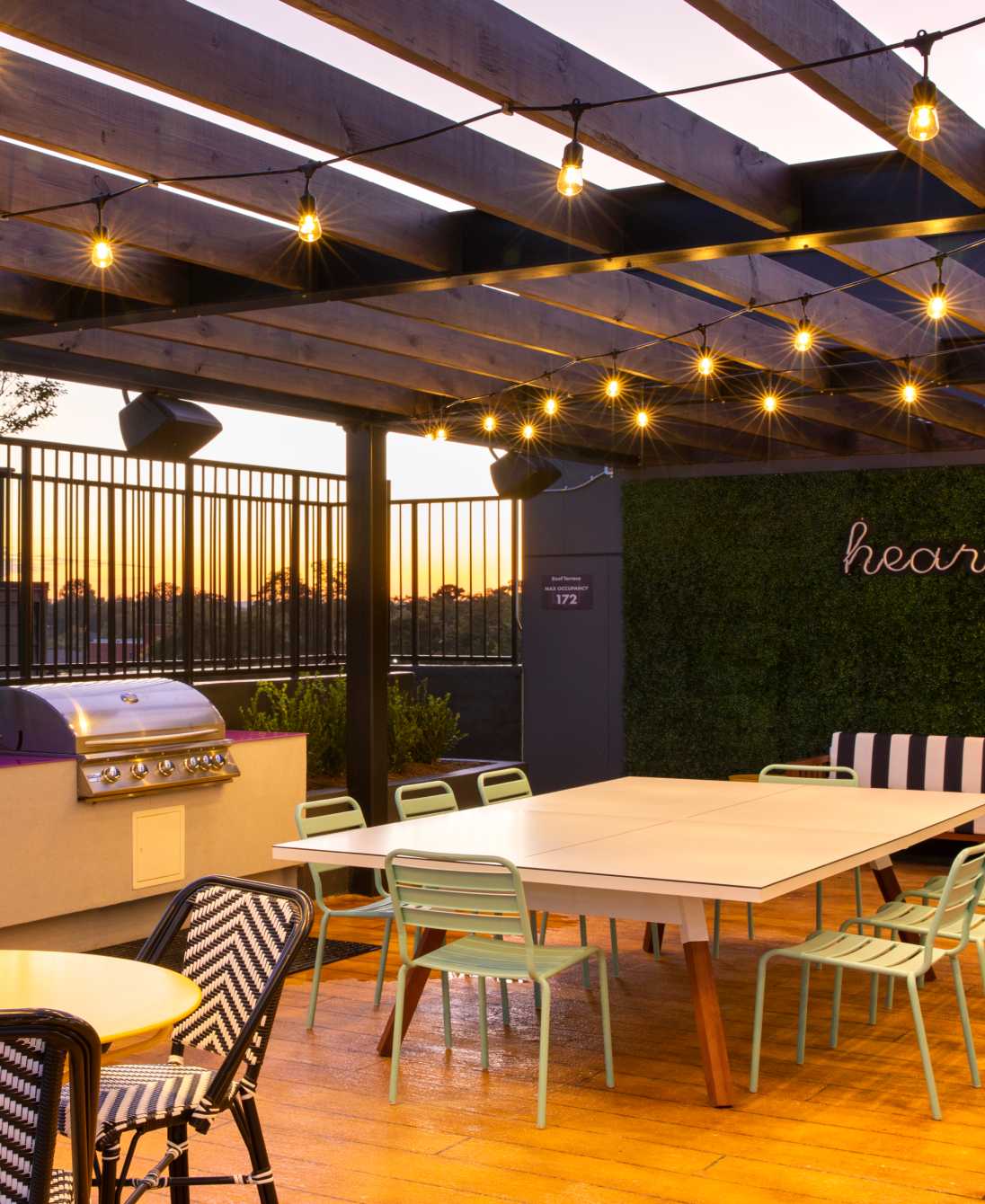 String lights hanging over an outdoor seating area